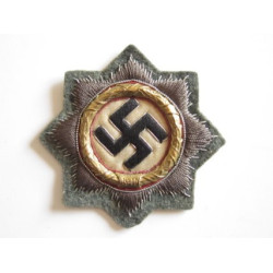 Cruz alemana en oro. Tela.