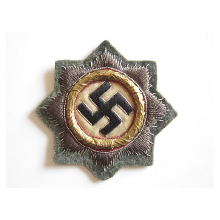 Cruz alemana en oro. Tela.