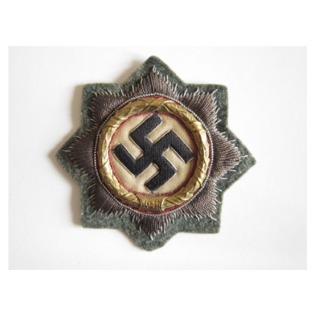 Cruz alemana en oro. Tela.