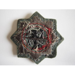 Cruz alemana en oro. Tela.