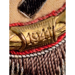 Cruz alemana en oro. Tela.